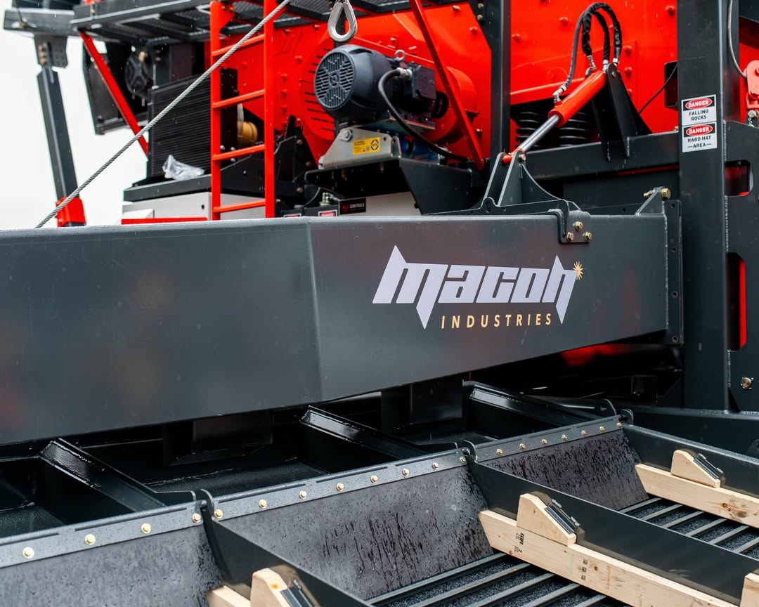 Mining equipment design detail showing Macon Industries wash plant components and sluice system in operation in remote environment